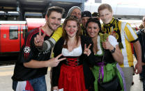 Borrussia Dortmund's and Bayern Munich's fans pose for a photograph at Wembley Park tube station before the Champions League Final at Wembley, London.