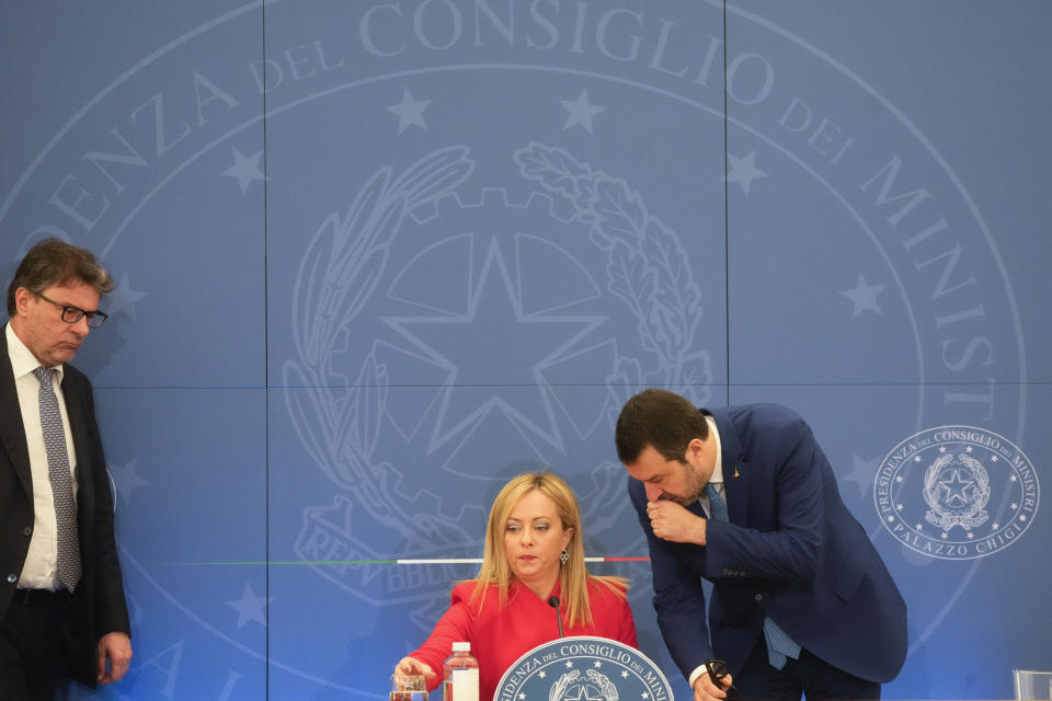 Italian Premier Giorgia Meloni, center, Finance Minister Giancarlo Giorgetti, left, and Deputy Prime Minister and Minister of Infrastructure and Sustainable Mobility Matteo Salvini arrive at a press conference to present the 2023 proposed budget in Rome, Tuesday, Nov. 22, 2022. (AP Photo/Gregorio Borgia)