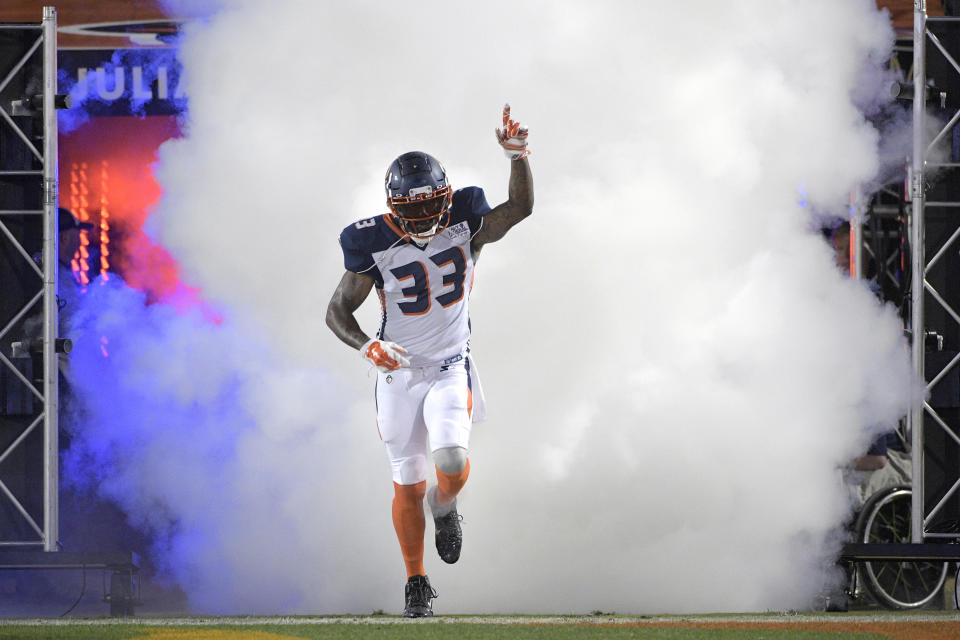 Orlando Apollos safety Will Hill III runs onto the field during player introductions for the team's Alliance of American Football game against the Atlanta Legends on Saturday, Feb. 9, 2019, in Orlando, Fla. (AP Photo/Phelan M. Ebenhack)
