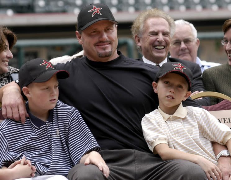 Kacy Clemens, left, with dad Roger Clemens and brother Kody in 2005. (AP)