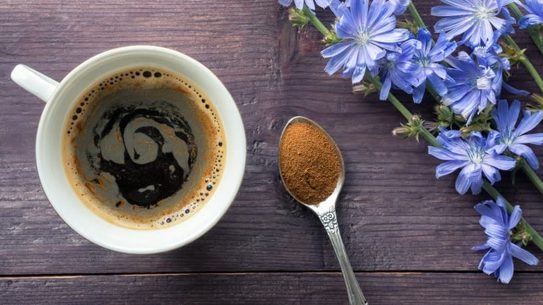 Top-down view of chicory coffee beside chicory flowers