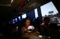 A Central American migrant, moving in a caravan through Mexico to request asylum in the U.S., travels to Tijuana, in San Luis Rio Colorado, Sonora state, Mexico April 25, 2018. REUTERS/Edgard Garrido