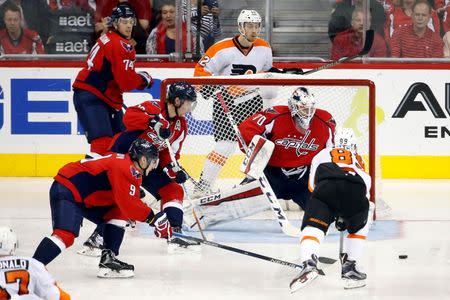 Apr 22, 2016; Washington, DC, USA; Washington Capitals goalie Braden Holtby (70) makes a save on Philadelphia Flyers center Sam Gagner (89) in the third period in game five of the first round of the 2016 Stanley Cup Playoffs at Verizon Center. Mandatory Credit: Geoff Burke-USA TODAY Sports