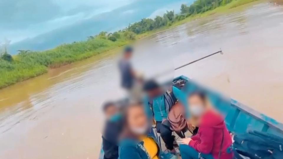 An image of crossing a river with a victim rescued by Thai authorities.