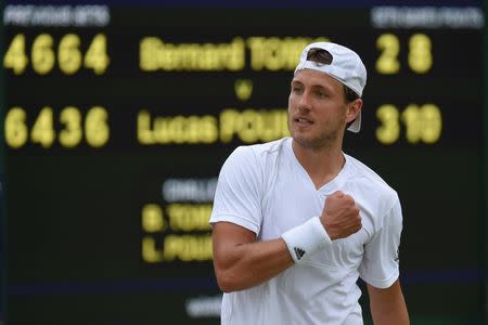 Britain Tennis - Wimbledon - All England Lawn Tennis & Croquet Club, Wimbledon, England - 4/7/16 France's Lucas Pouille celebrates winning his match against Australia's Bernard Tomic REUTERS/Toby Melville