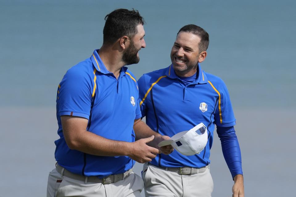 Team Europe's Jon Rahm and Team Europe's Sergio Garcia react after winning their foursome match the Ryder Cup at the Whistling Straits Golf Course Friday, Sept. 24, 2021, in Sheboygan, Wis. (AP Photo/Ashley Landis)