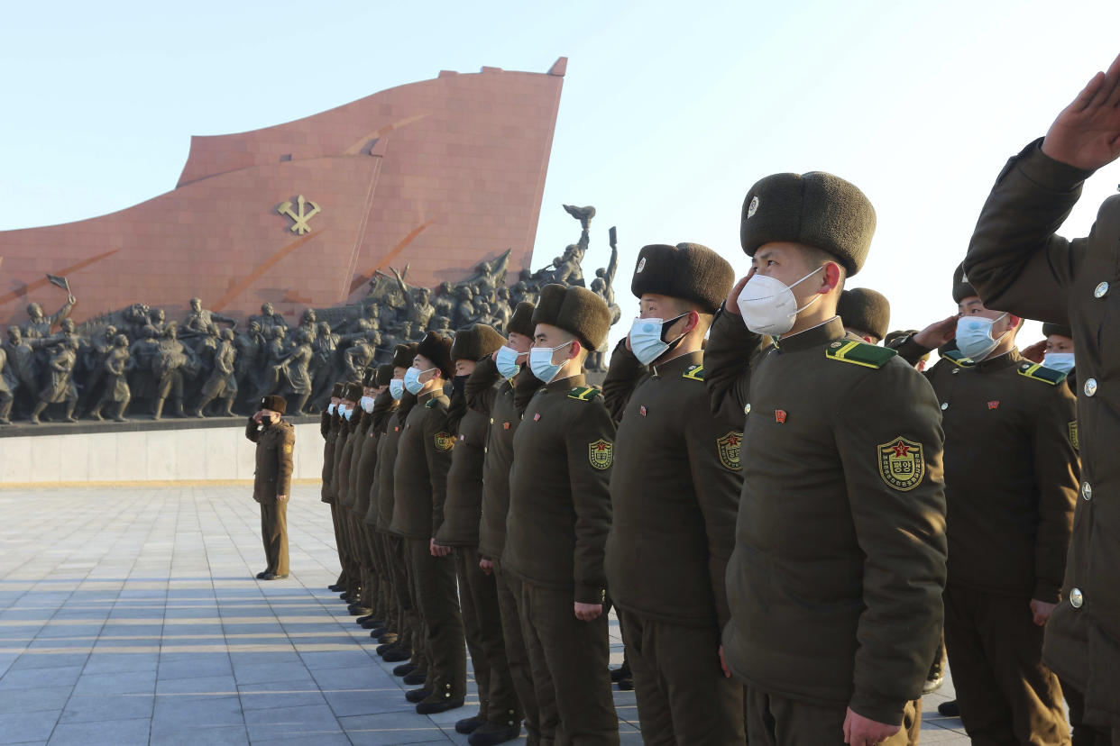 Public Security Forces soldiers salute to the statues of their late leaders Kim Il Sung and Kim Jong Il on the occasion of the 75th founding anniversary of the Korean People's Army in Pyongyang, North Korea Wednesday, Feb. 8, 2023. (AP Photo/Jon Chol Jin)