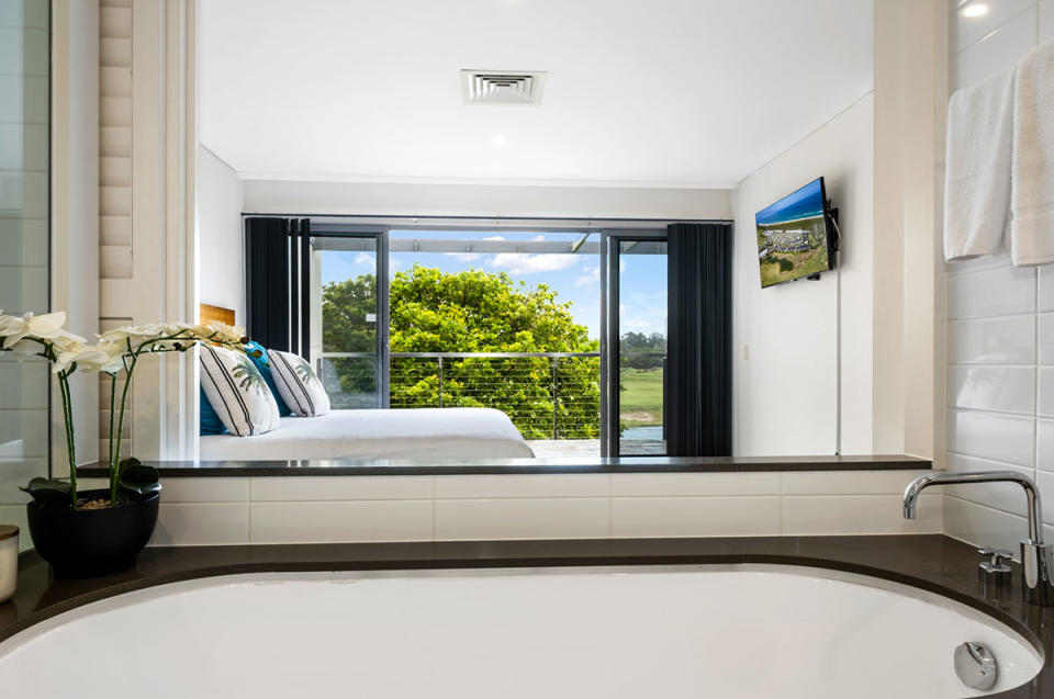 Pullman Magenta Shores Resort bath and bedroom in a villa
