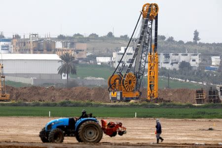 FILE PHOTO - Heavy machinery can be seen at work along Israel's border with the Gaza Strip, as seen from Kfar Aza, southern Israel February 28, 2017. REUTERS/Amir Cohen/File Photo