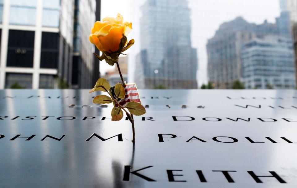 A flower is seen at the South pool of the 9/11 Memorial during ceremonies marking the 17th anniversary of the September 11, 2001 terrorist attacks in New York on September 11, 2018.
