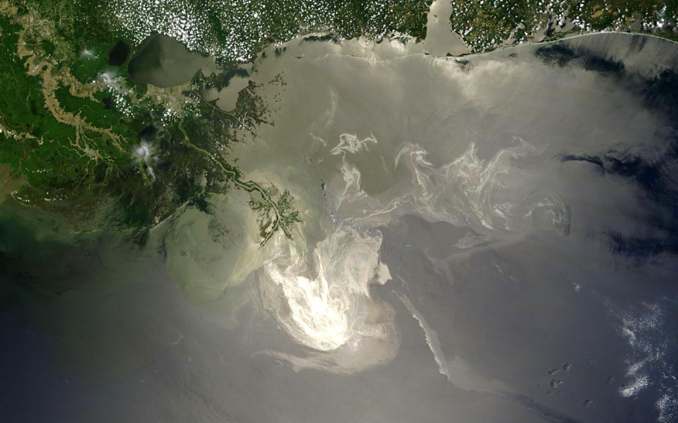 <span class="caption">A satellite image of the oil slick as it looked in late May 2010, a month after the Deepwater Horizon well exploded. The oil plume looks grayish white. </span> <span class="attribution"><a class="link " href="https://www.youtube.com/watch?v=mCWW5xt3Hc8" rel="nofollow noopener" target="_blank" data-ylk="slk:NASA/Goddard/Jen Shoemaker and Stu Snodgrass;elm:context_link;itc:0;sec:content-canvas">NASA/Goddard/Jen Shoemaker and Stu Snodgrass </a></span>