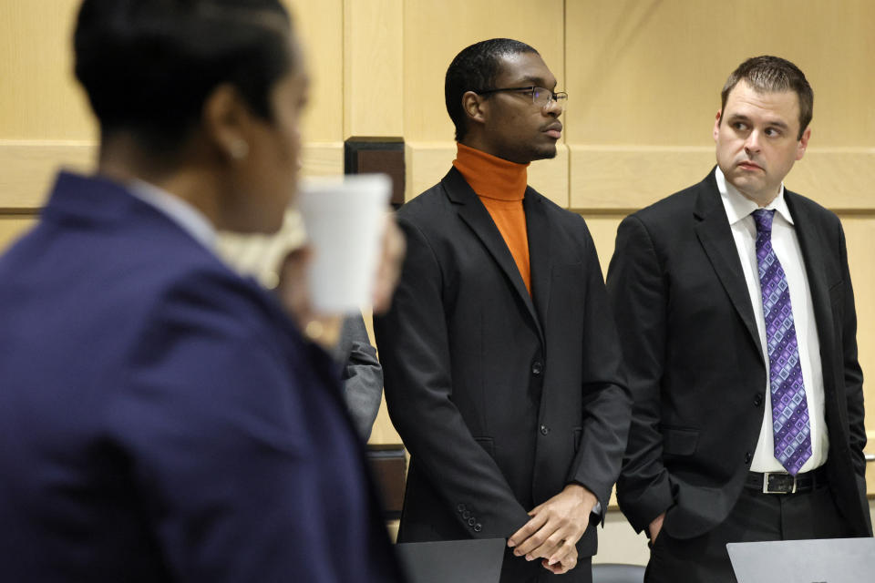 Shooting suspect Michael Boatwright, center, stands for the jury to enter the courtroom for closing arguments in the XXXTentacion murder trial at the Broward County Courthouse in Fort Lauderdale, Fla., on Tuesday, March 7, 2023. Emerging rapper XXXTentacion, born Jahseh Onfroy, 20, was killed during a robbery outside of Riva Motorsports in Pompano Beach in 2018, allegedly by defendants Boatwright, Trayvon Newsome, and Dedrick Williams. (Amy Beth Bennett/South Florida Sun-Sentinel via AP, Pool)