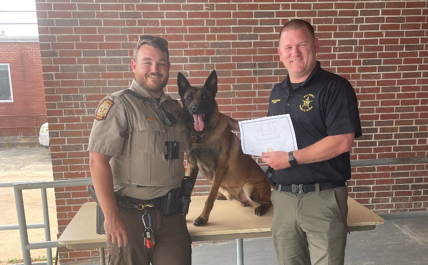 Deputy Cody Johnson (left), K9 Eddy (middle), Sheriff Mason Bynum (right)