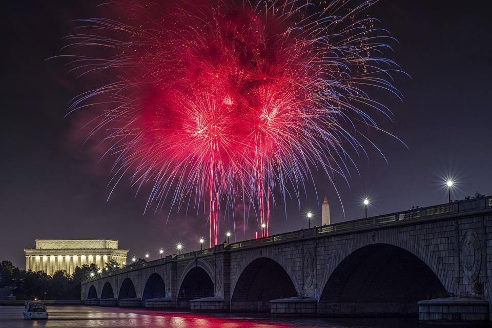 <p>Fireworks burst over the Memorial Bridge during Independence Day celebrations on the National Mall in Washington, Tuesday, July 4, 2017. (AP Photo/J. David Ake) </p>