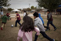 Students play soccer during recess at V. H. Lassen Academy of Science and Nutrition in Phoenix, Tuesday, Jan. 31, 2023, in Phoenix. (AP Photo/Alberto Mariani)