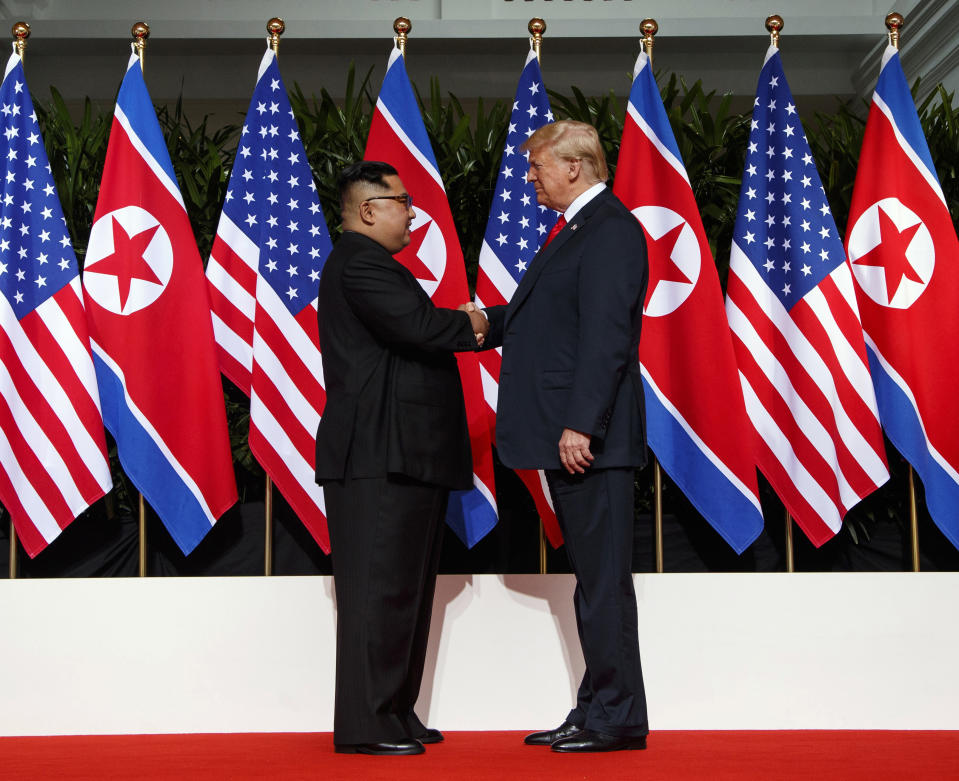 FILE - In this June 12, 2018, file photo, North Korean leader Kim Jong Un, left, and U.S. President Donald Trump shake hands prior to their meeting on Sentosa Island in Singapore. The upcoming Trump-Kim meeting will be a crucial moment for South Korean President Moon Jae-in, who is desperate for more room to continue his engagement with North Korea, which has been limited by tough U.S.-led sanctions against Pyongyang. (AP Photo/Evan Vucci, File)