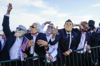 Fans wearinbg former US presidents masks cheer during a four-ball match the Ryder Cup at the Whistling Straits Golf Course Friday, Sept. 24, 2021, in Sheboygan, Wis. (AP Photo/Jeff Roberson)