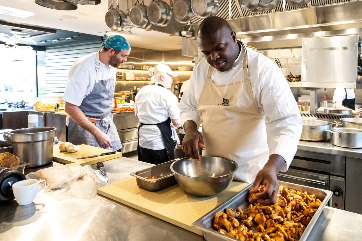 Executive chef Ian Robertson prepares mushrooms at Oak Park in Des Moines.