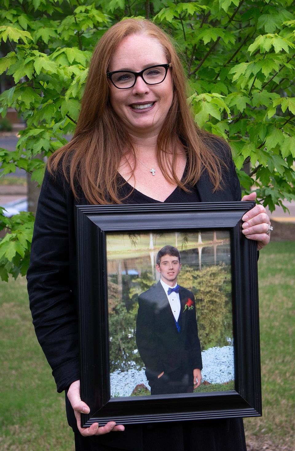 Anna Lopez holds a photo of her son, Grant, who died after a car crash. Lopez chose to donate Grant's organs after his death.