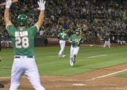 Aug 31, 2018; Oakland, CA, USA; Oakland Athletics second baseman Jed Lowrie (8) scores during the sixth inning against the Seattle Mariners at Oakland Coliseum. Mandatory Credit: Neville E. Guard-USA TODAY Sports