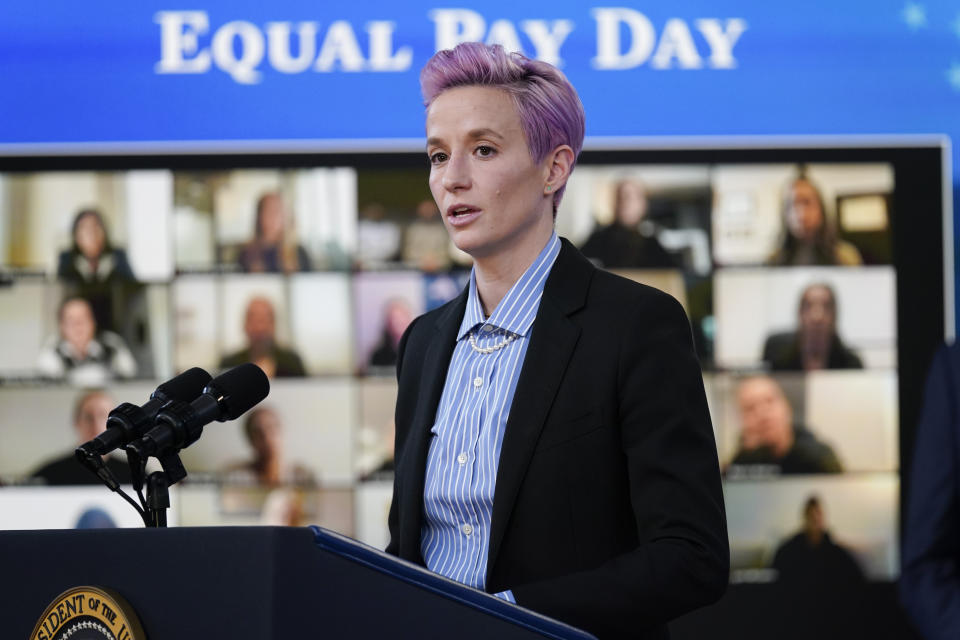 FILE - United States soccer women's national team member Megan Rapinoe speaks during an event to mark Equal Pay Day in the South Court Auditorium in the Eisenhower Executive Office Building on the White House Campus Wednesday, March 24, 2021, in Washington. The House has passed a bill that ensures equal compensation for U.S. women competing in international events, a piece of legislation that came out of the U.S. women's soccer team's long battle to be paid as much as the men. The Equal Pay for Team USA Act, passed late Wednesday night, Dec. 21, 2022, now heads to President Joe Biden's desk. (AP Photo/Evan Vucci, File)