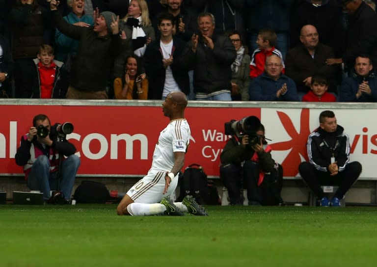 Swansea City's Andre Ayew celebrates after scoring a goal against Tottenham Hotspurs on October 4, 2015