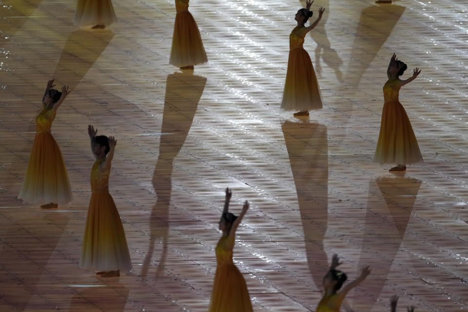 Artists dance during the opening ceremony of the 19th Asian Games in Hangzhou, China, Saturday, Sept. 23, 2023. (AP Photo/Eugene Hoshiko)