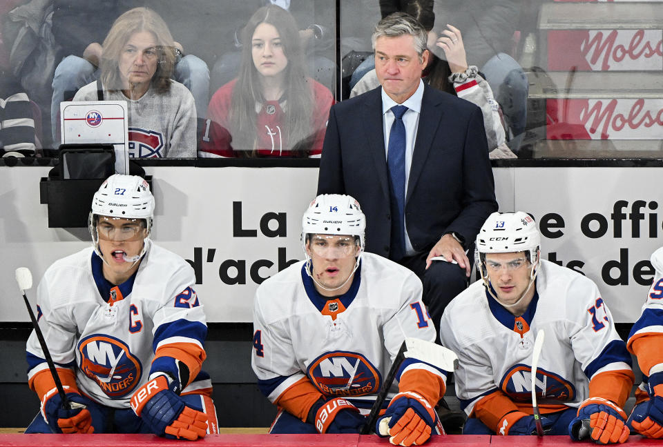 New York Islanders coach Patrick Roy watches from the bench during the first period of the team's NHL hockey game against the Montreal Canadiens on Thursday, Jan. 25, 2024, in Montreal. (Graham Hughes/The Canadian Press via AP)