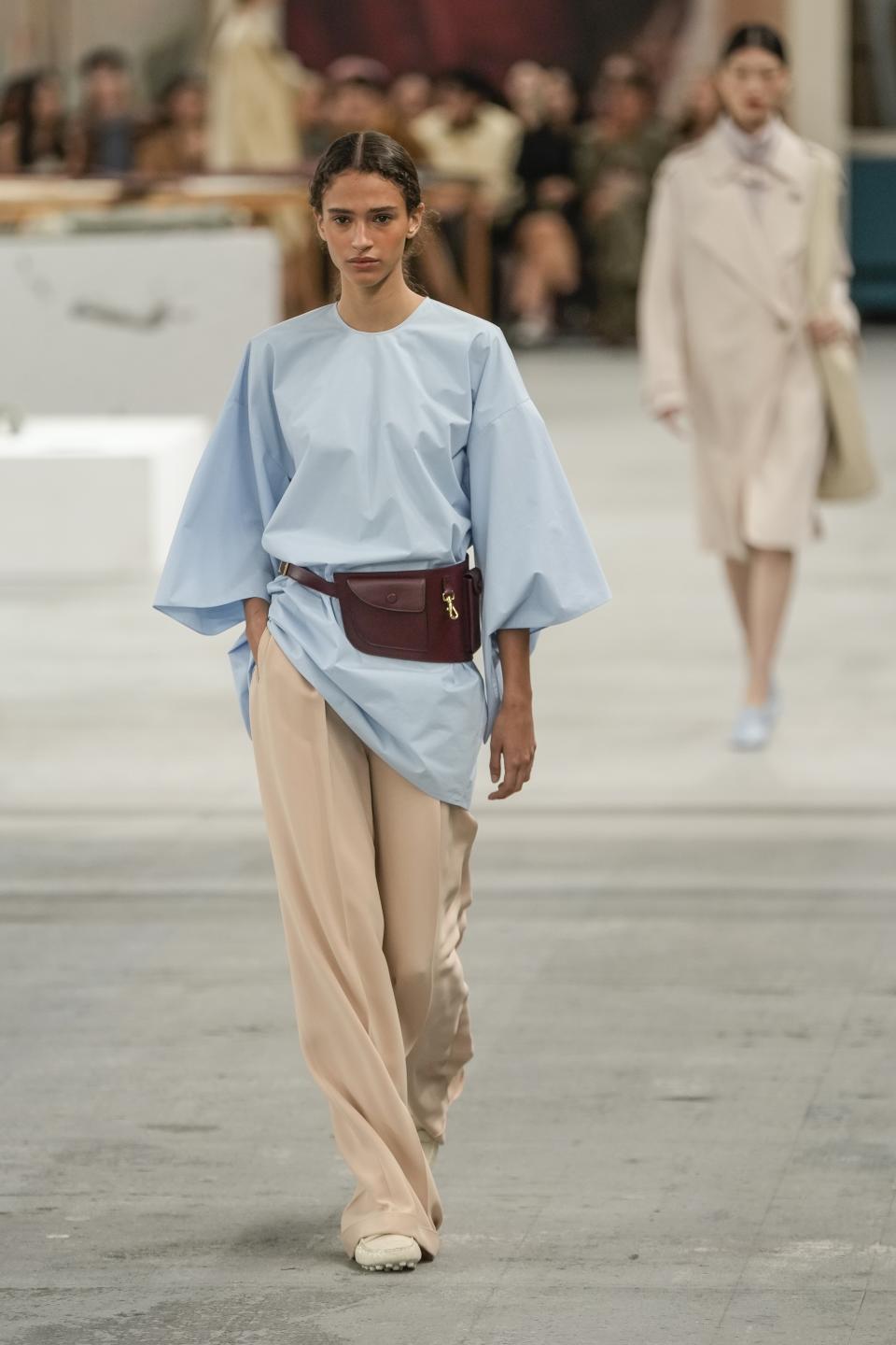 A model wears a creation as part of the Tod's women's Spring Summer 2024 collection presented in Milan, Italy, Friday, Sept. 22, 2023. (AP Photo/Luca Bruno)