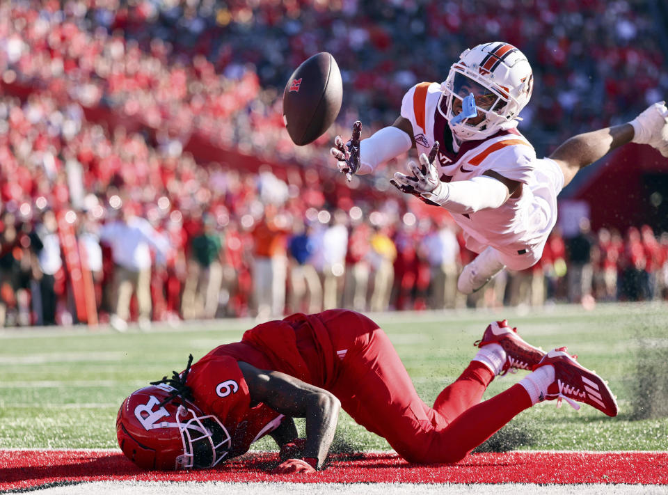 Virginia cornerback Mansoor Delane (4, right) is unable to intercept a pass in the end zone intended for Rutgers wide receiver JaQuae Jackson (9) during the second quarter of an NCAA college football game, Saturday, Sept. 16, 2023, in Piscataway, N.J. (Andrew Mills/NJ Advance Media via AP)