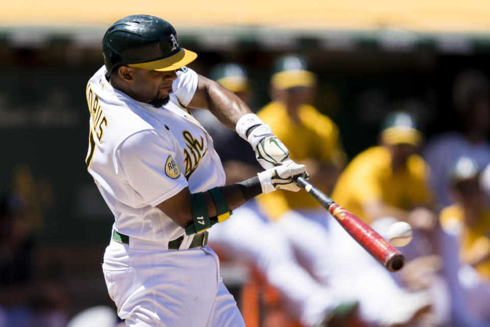 Oakland Athletics' Elvis Andrus hits an RBI double against the Houston Astros during the seventh inning of a baseball game in Oakland, Calif., Wednesday, June 1, 2022. (AP Photo/John Hefti)