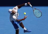 Tennis - Australian Open - Margaret Court Arena, Melbourne, Australia, January 16, 2018. Donald Young of the U.S. serves against Novak Djokovic of Serbia. REUTERS/Issei Kato