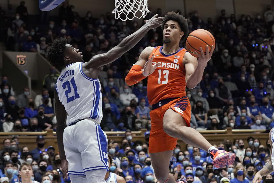 Clemson guard David Collins (13) drives to the basket while Duke forward A.J. Griffin (21) defends during the first half of an NCAA college basketball game in Durham, N.C., Tuesday, Jan. 25, 2022. (AP Photo/Gerry Broome)