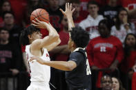 Rutgers guard Geo Baker (0) shoots a 3-pointer with Purdue guard Nojel Eastern (20) defending during the first half of an NCAA college basketball game Tuesday, Jan. 28, 2020, in Piscataway, N.J. (AP Photo/Kathy Willens)