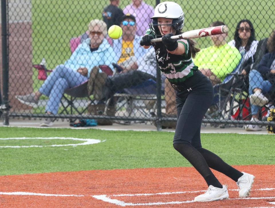 Clear Fork's Mel Blubaugh lays down a bunt in the first inning of the Colts' 2-1 Division II district semifinal win over Norwalk on Tuesday night.