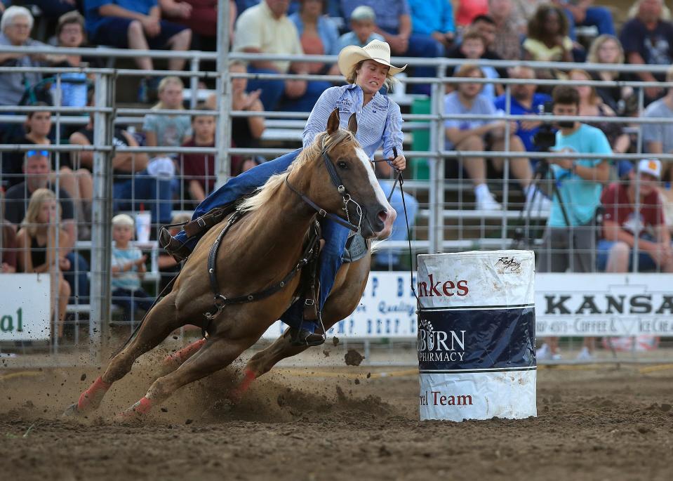 Barrel racer Ilyssa from Hico, Texas, rounds the second barrel during the 76th annual Wild Bill Hickok PRCA Rodeo Bulls, Broncs and Barrels night Wednesday, August 3, 2022, at Eisenhower Park in Abilene.