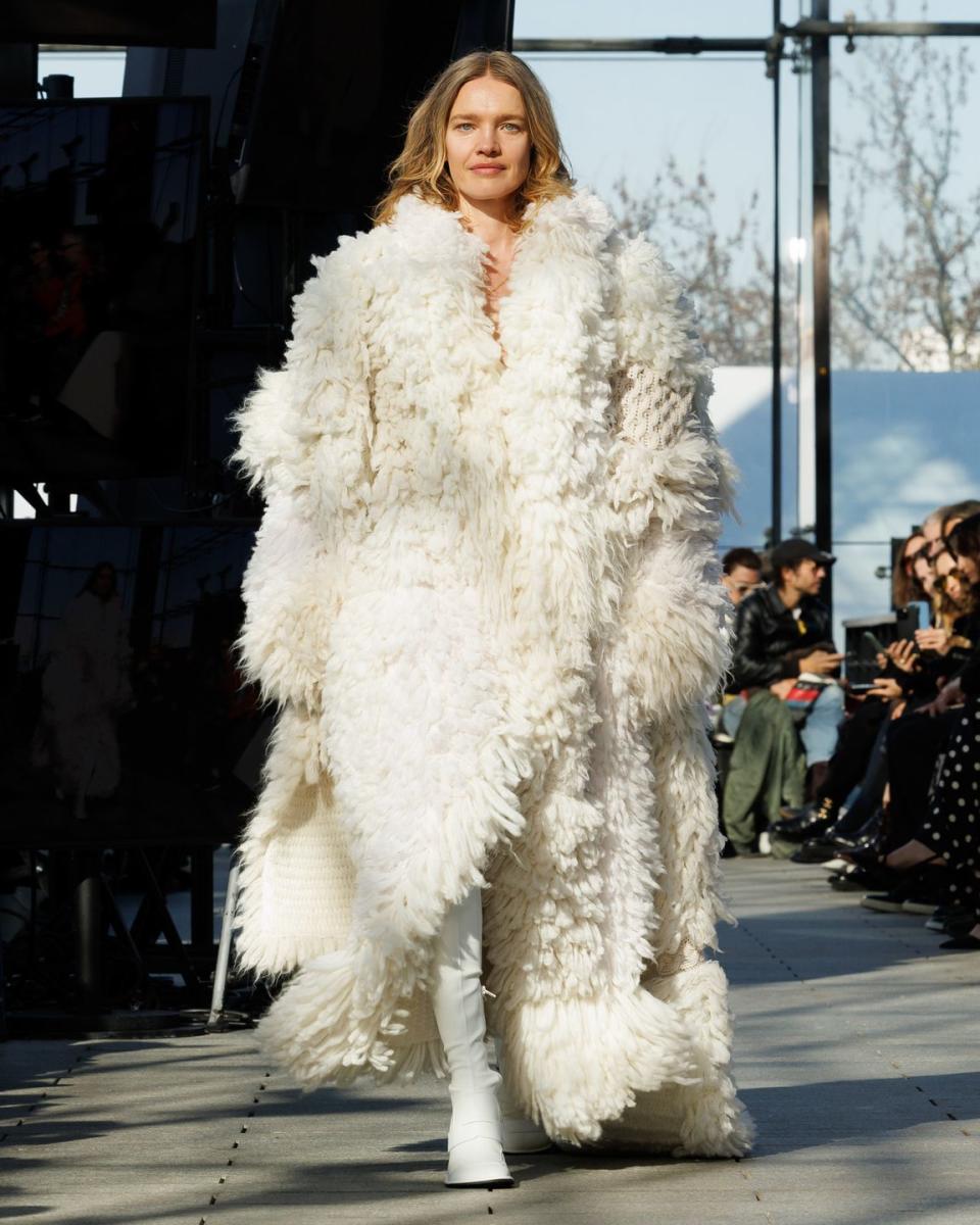 a person wearing a fur coat