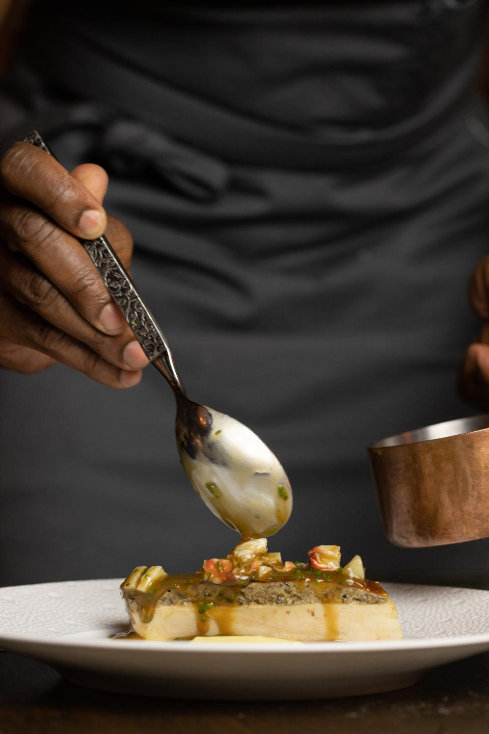 Charlie Mitchell plates a dish at Michelin-starred restaurant Clover Hill in Brooklyn Heights. (Natalie Black Photography)