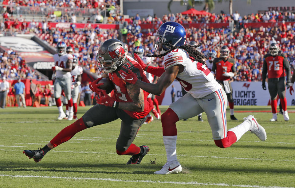 Tampa Bay Buccaneers wide receiver Mike Evans (13) beats New York Giants cornerback Janoris Jenkins (20) to the endzone to score his third touchdown during the first half of an NFL football game Sunday, Sept. 22, 2019, in Tampa, Fla. (AP Photo/Mark LoMoglio)