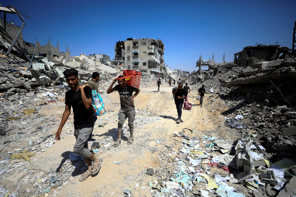 Palestinians walk through the decimated neighborhood of Shejaiya to inspect the damage and search for belongings after Israeli forces withdrew from the eastern neighborhood of Gaza City amid the ongoing Israel-Hamas conflict, July 10, 2024. / Credit: Dawoud Abu Alkas /REUTERS