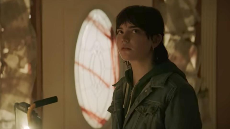 Sophie Thatcher stands in front of a door with blood on its glass and looks at something unseen in The Boogeyman trailer