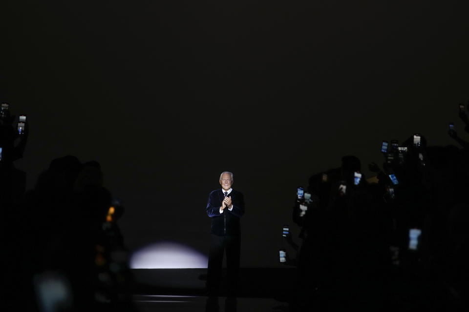 Giorgio Armani accepts applause after the Giorgio Armani Prive Haute Couture Spring-Summer 2024 collection presented in Paris, Tuesday, Jan. 23, 2024. (AP Photo/Christophe Ena)