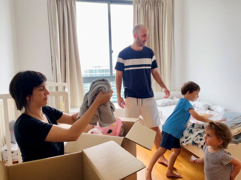 Israeli expatriate Atar Sandler packs up with her husband and children in their apartment in central Singapore