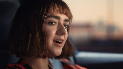 This undated image provided by Audi shows Maisie Williams in a scene from the company's 2020 Super Bowl NFL football spot. Arya can sing as well as battle enemies, it turns out. “Game of Thrones” actress Maisie Williams belts out the hit Disney song from “Frozen, “Let it Go,” as she drives an Audi through steaming heat and traffic in a 60-second ad that promotes Audi’s e-tron family of electric vehicles. The ad airs in the second quarter. (Jeff Forney/Audi via AP)