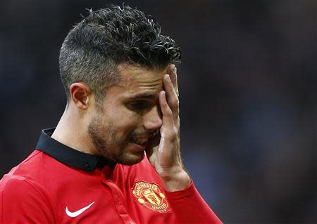 Manchester United's Robin van Persie reacts after losing to Newcastle United in their English Premier League soccer match at Old Trafford in Manchester, northern England, December 7, 2013. REUTERS/Darren Staples