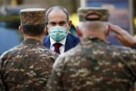 In this photo provided by the Armenian Prime Minister Press Service via PAN Photo, Armenian Prime Minister Nikol Pashinyan arrives to visit a military hospital in Yerevan, Armenia, Friday, Oct. 23, 2020. Heavy fighting is raging over Nagorno-Karabakh even as top diplomats from Armenia and Azerbaijan have traveled to Washington for negotiations on settling the neighboring countries’ decades-long conflict. (Tigran Mehrabyan, Armenian Prime Minister Press Service/PAN Photo via AP)