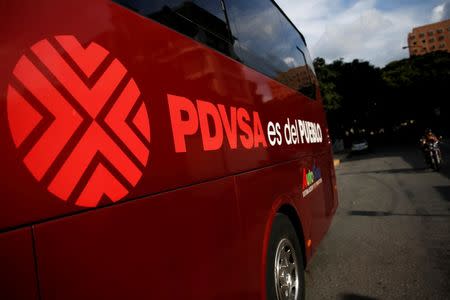 The logo of the Venezuelan oil company PDVSA and text that reads "PDVSA is for the people" are seen on a bus in Caracas, Venezuela July 21, 2016. Picture taken July 21, 2016. REUTERS/Carlos Garcia Rawlins