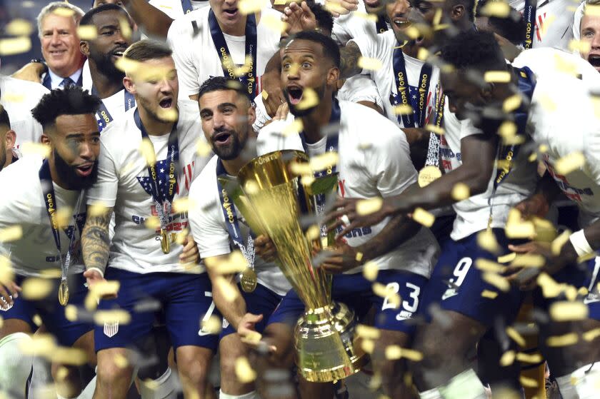 United States celebrate their extra-time victory over Mexico in the CONCACAF Gold Cup final soccer match Sunday, Aug. 1, 2021, in Las Vegas. (AP Photo/David Becker)