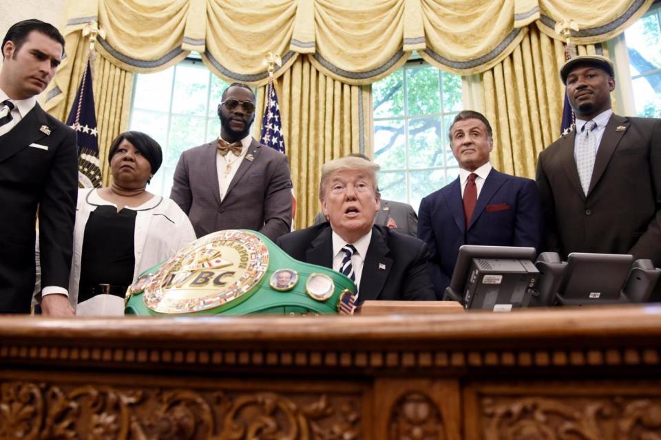 Trump with (from R to L) Miguel Torruco Garza, Linda Haywood, Great great niece of Jack Johnson, Deontay Wilder, Keith Frankel, Sylvester Stallone, and Lennox LewisPhoto: EPA/Olivier Douliery