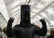 Lord Buckethead of the Monster Raving Loony Party poses for the media as ballot papers are counted at Britain's Prime Minister Boris Johnson's Uxbridge and South Ruislip constituency count declaration at Brunel University in Uxbridge, London, Friday, Dec. 13, 2019. (AP Photo/Kirsty Wigglesworth)